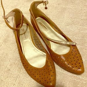 BCBGeneration camel brown flats with ankle strap.